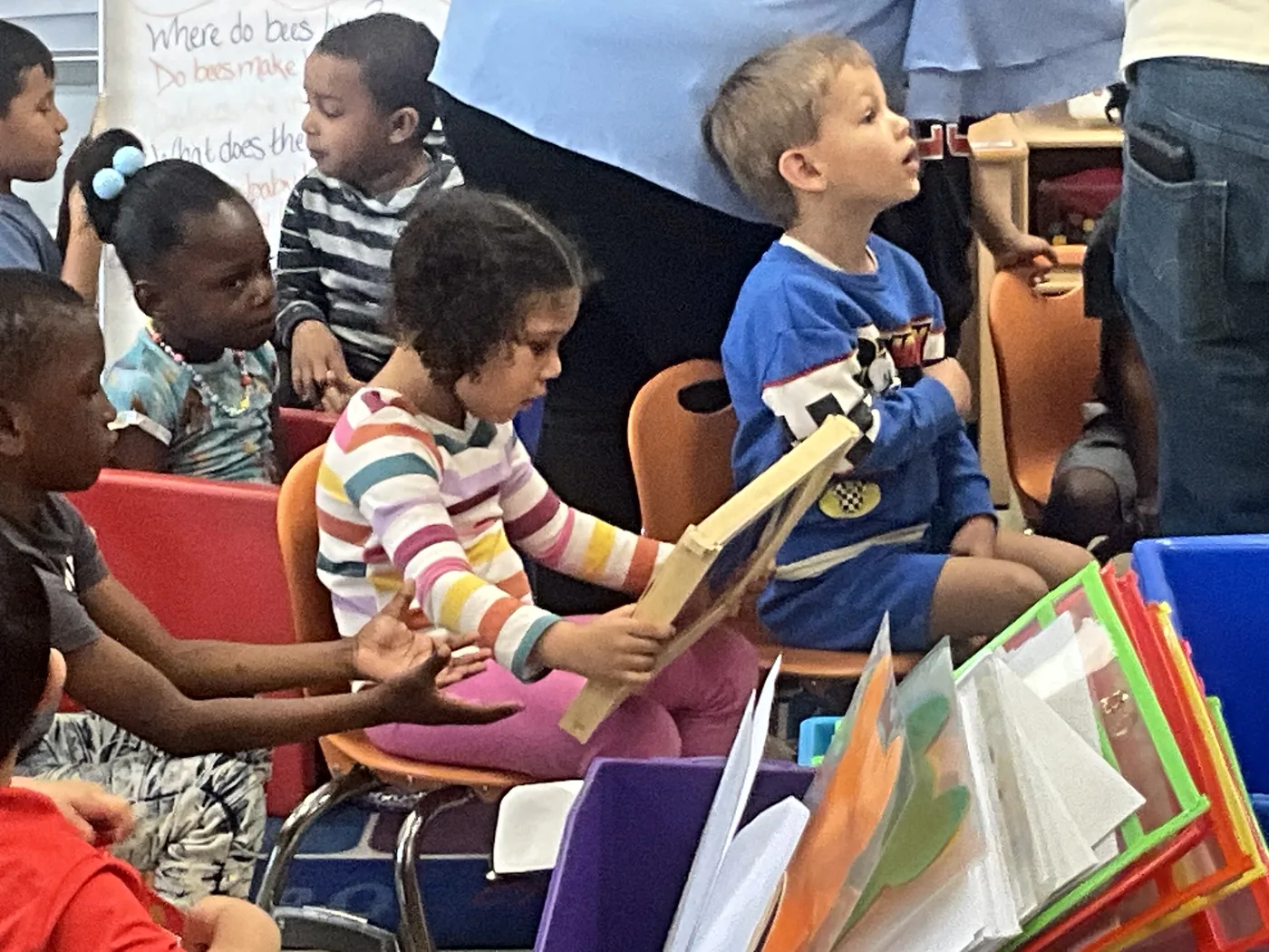 Students look through pollinator books and activity materials