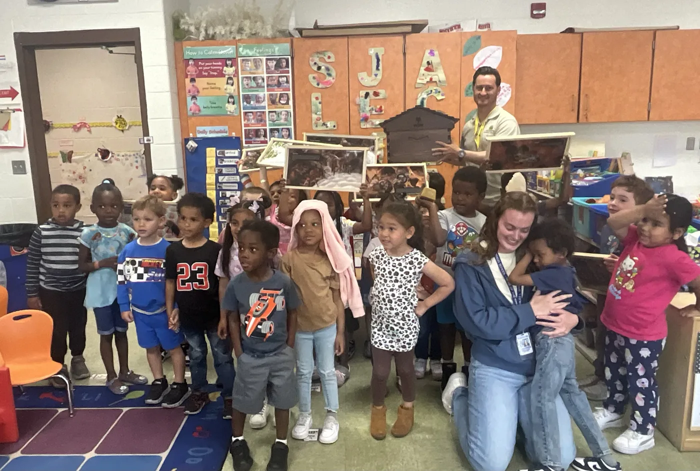 The class gathers for a group photo after their pollinator lesson