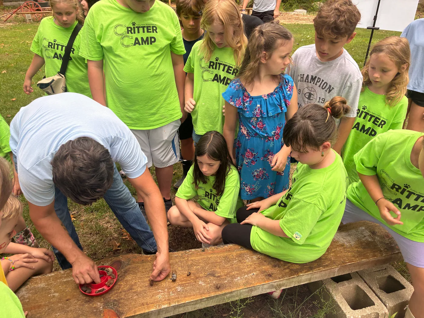 Campers gathered around the work table for a closer look